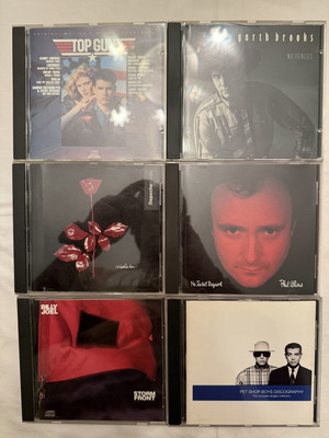 Συλλογή 6 CD με εμβληματικά άλμπουμ όπως Top Gun και Depeche Mode σαν καινούργια