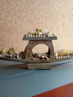 Vintage wooden gondola used, decorated with shells
