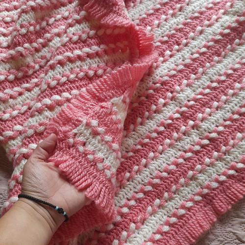Knitted handmade crib blanket used pink white