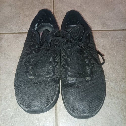 Nike athletic shoes in good condition with some wear, size 40