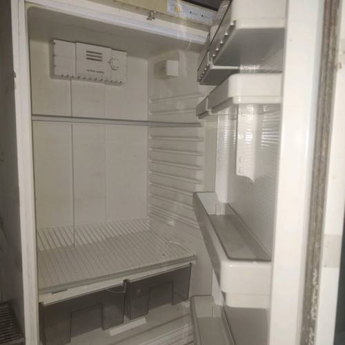 Old refrigerator used for spare parts