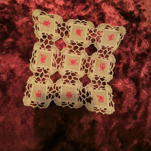 Handicraft with red design and gift napkin