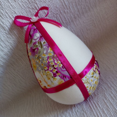 Decorative egg used in floral purple and fuchsia