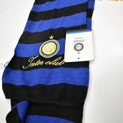 Inter collection with scarves, pennants, cufflinks, magazines and backpack