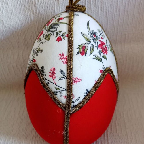 Geometric decorative egg used, red and floral design