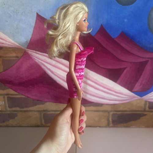 Mattel Barbie Beach doll with pink swimsuit and fuchsia dress