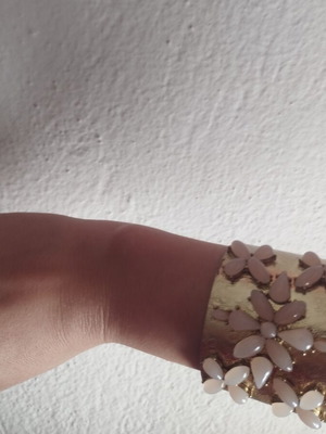 Gold bracelet with pink details