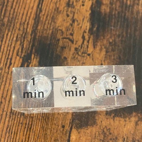 Hourglass with 3 time intervals (1, 2, and 3 minutes) used
