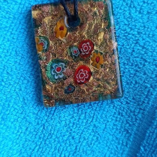 Murano pendant with millefiori floral design and aventurine base
