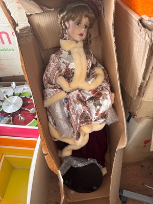 Porcelain collectible doll new with stand