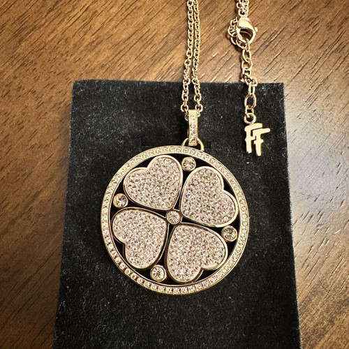 Folli Follie jewelry set with double-sided long necklace, hoop earrings, and two rings