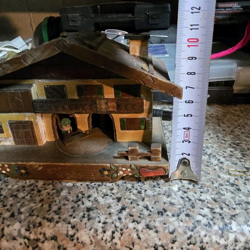 Vintage alpine wooden house used with figures