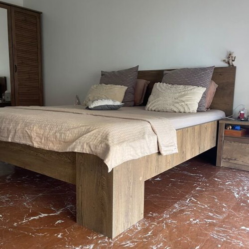 Complete bedroom set used, includes bed, nightstands, drawers, TV unit, coffee table