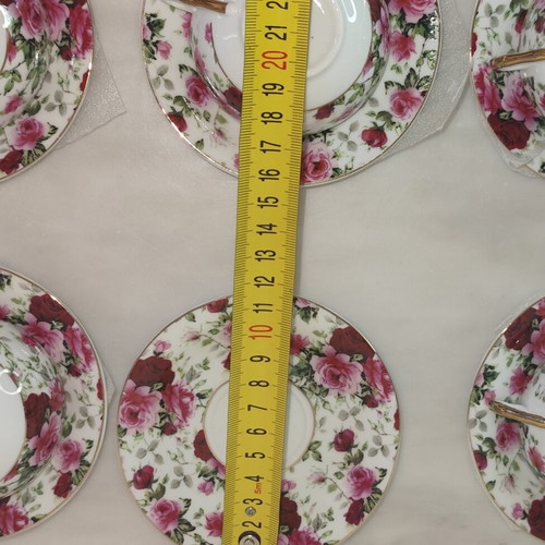 Vintage porcelain tea cups set with floral rose pattern and lithophany