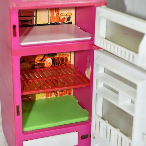 Retro children's kitchen fridge used, plastic and metal with illustration