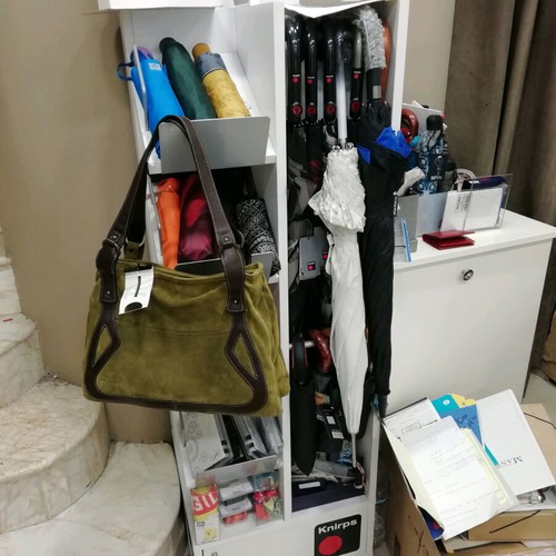 Professional umbrella stand like new, rotating for umbrellas