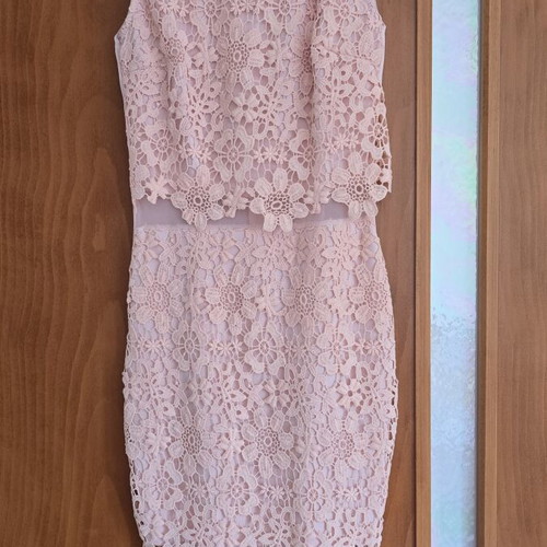 Lace dress in salmon peach shade with floral pattern and waist detail
