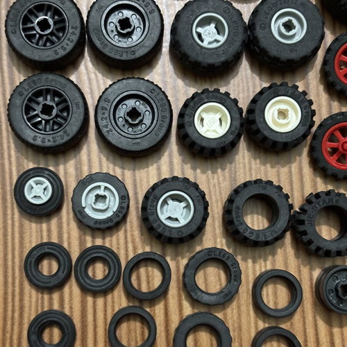 Lego wheels set like new, 65 parts including tires and inner pieces