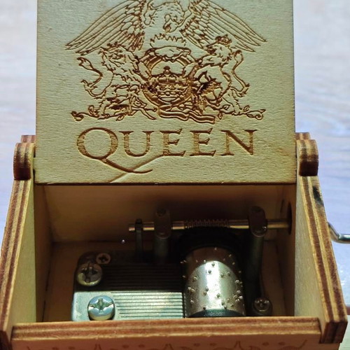 Wooden Queen Music Box like new with hand crank and engraved design