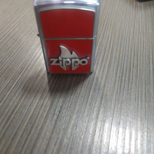 Zippo flame red new with case and replacement stones