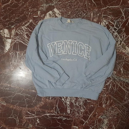 H&M woman's sweater light blue with Venice logo used
