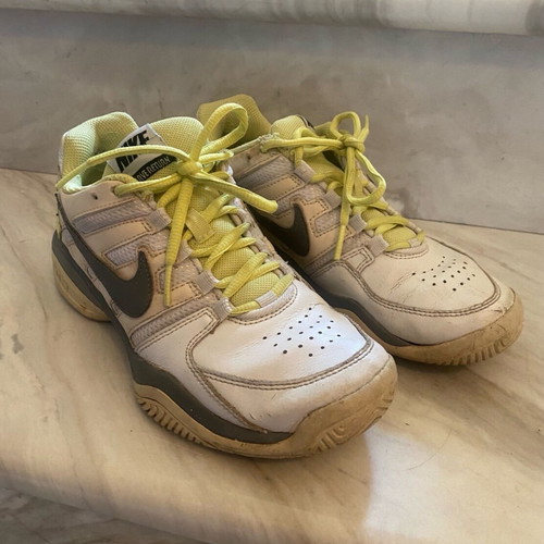 Nike athletic shoes used, white yellow, size 38