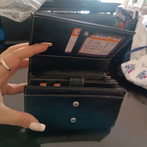 Vintage black leather wallet used with embroidery and multiple compartments