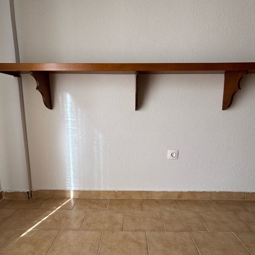 Wooden wall shelf with decorative supports like new