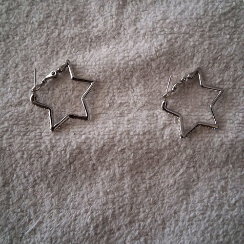 Star-shaped earrings lightly worn