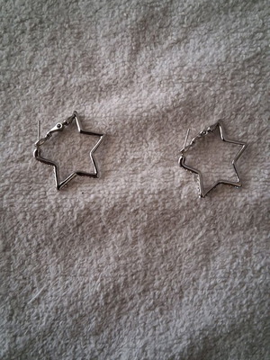 Star-shaped earrings lightly worn