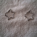 Star-shaped earrings lightly worn