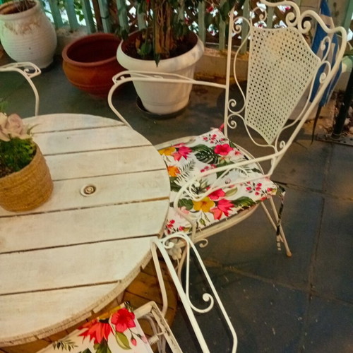 Wrought iron chairs set with round wooden table, vintage