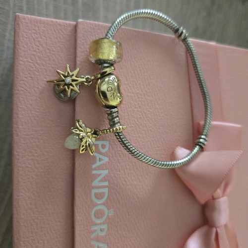 Pandora authentic bracelet like new with 3 gift charms silver and gold