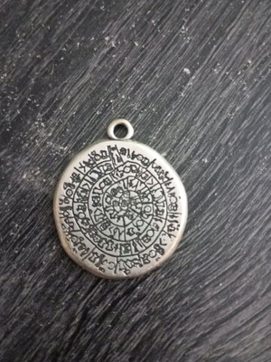 Phaistos Disc pendant like new, silver color