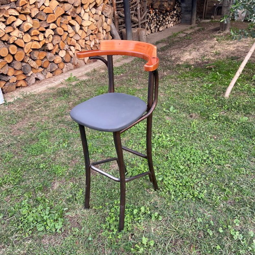 Stool like new with leatherette seat and wooden backrest