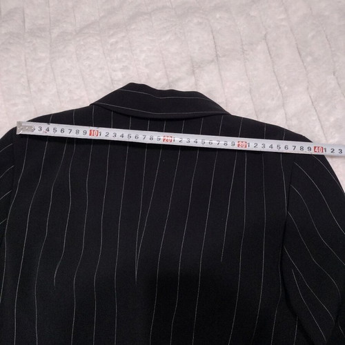 Women's black two-piece suit like new with white pinstripe size M