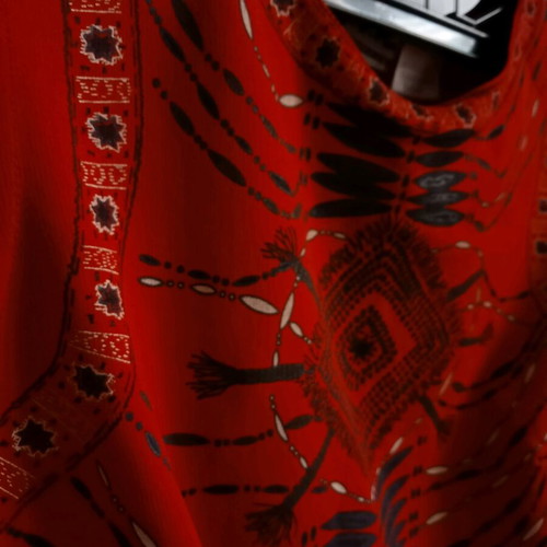 Red sleeveless top with ethnic geometric motifs, like new