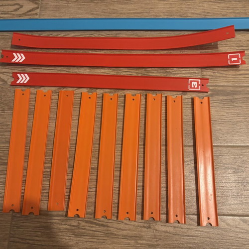 Hot Wheels track set with orange straight and colored action pieces