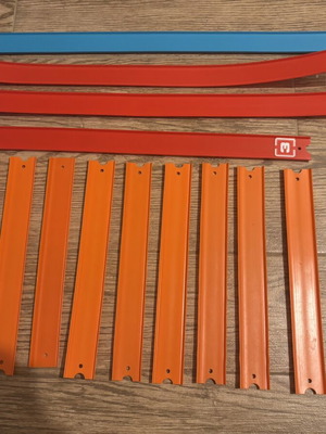 Hot Wheels track set with orange straight and colored action pieces