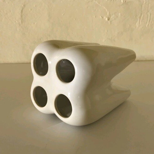 Tooth-shaped toothbrush holder unused