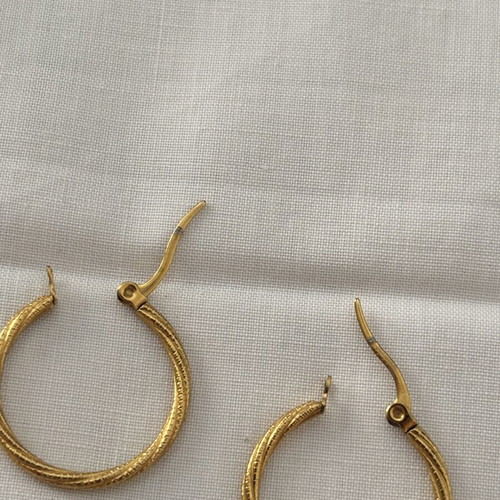 Iron golden rings with a twisted design.
