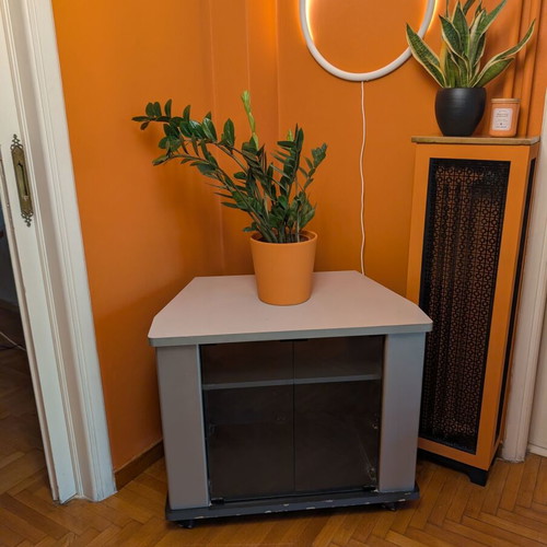 Corner showcase TV stand with wheels used, wood and glass doors