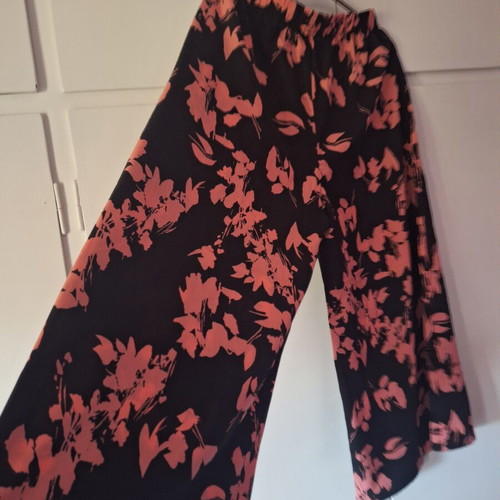 Pants new, black with pink flowers, sizes L and XL