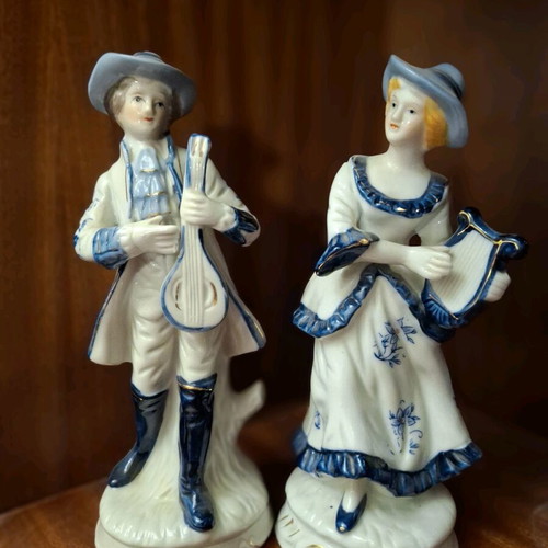 Porcelain figurine set used, woman with lyre and man with mandolin