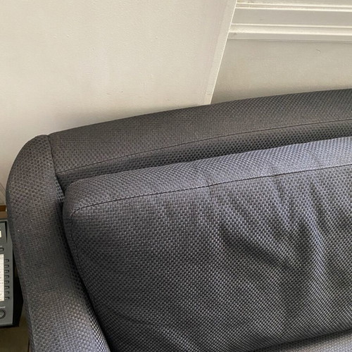 Sofa four-seater like new, black fabric, metal legs