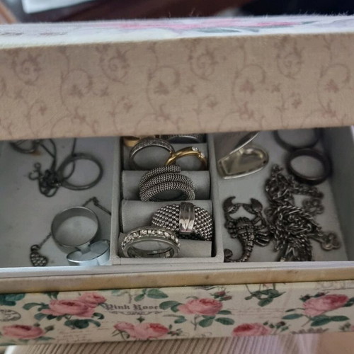 Jewelry box with various used rings and pendants