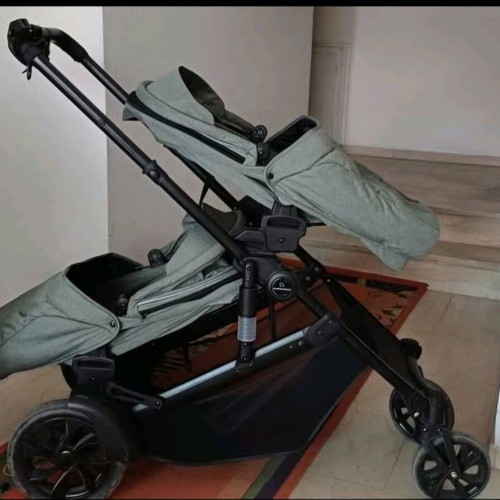 Twin stroller like new with footmuffs and carrycots