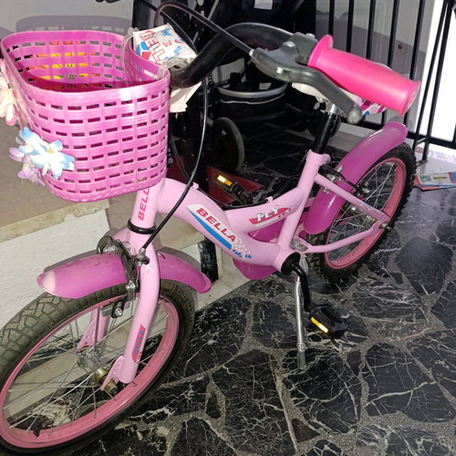 Girl's bicycle 16" wheels used, with basket and stand