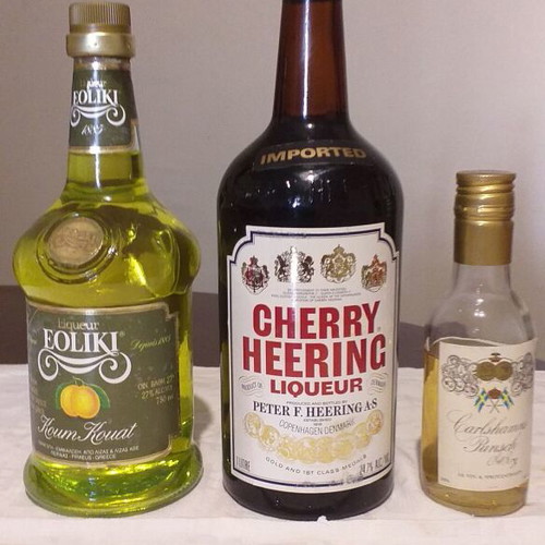 Old wine set with 2 sealed bottles Cherry Heering and Kumquat plus 185 ml Carlhamns Punsch