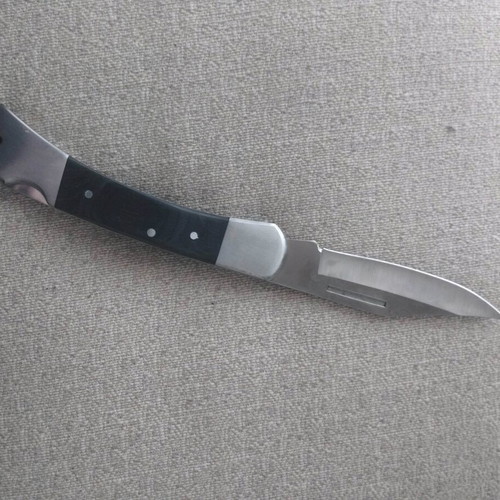Metal folding knife with stainless blade like new